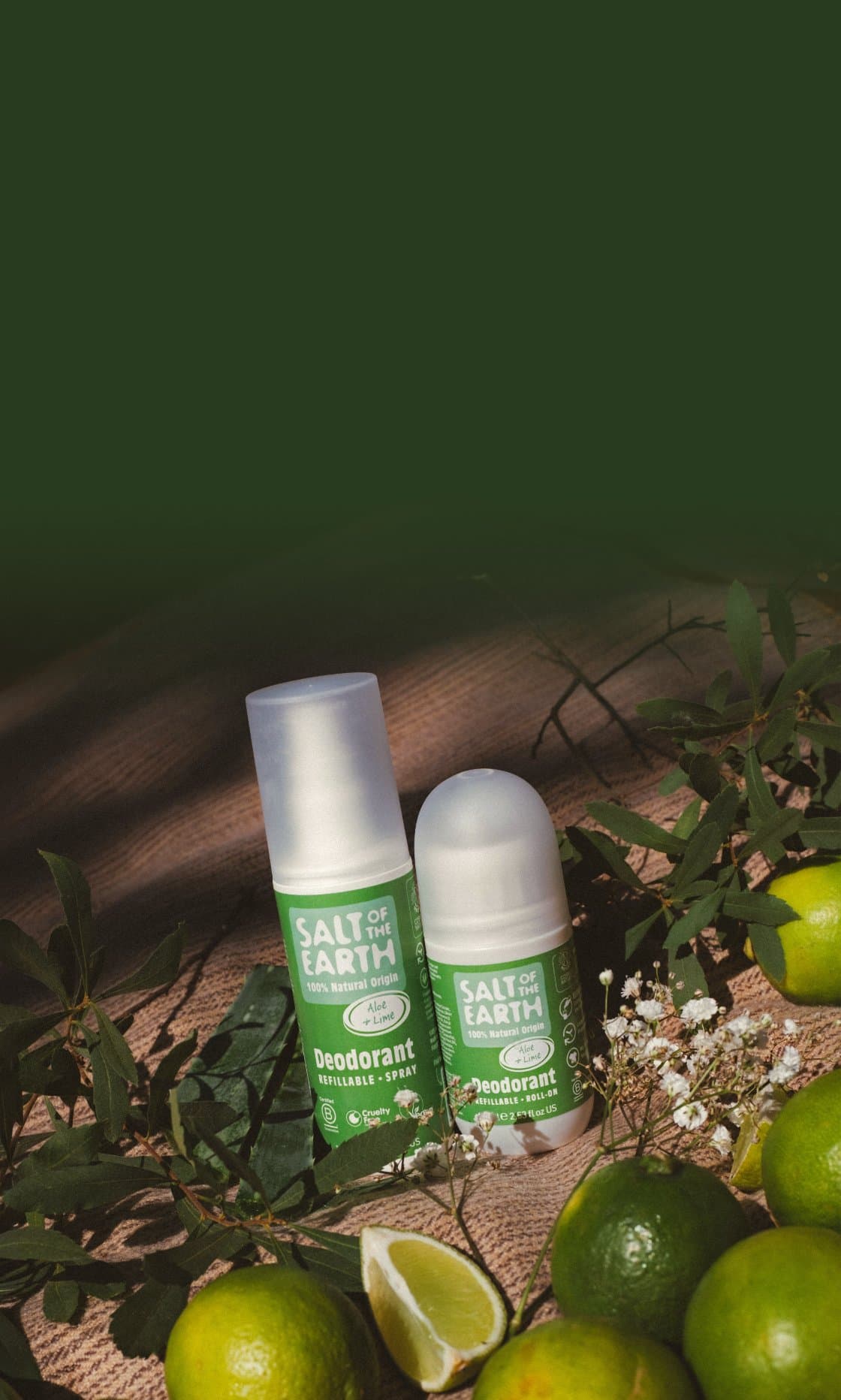 Salt of the Earth Aloe & Lime natural deodorant spray and roll-on beside fresh limes